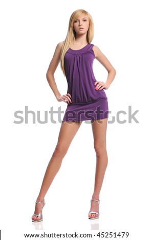 Young teen woman wearing a purple dress posing isolated on a white background Royalty-Free Stock Photo #45251479