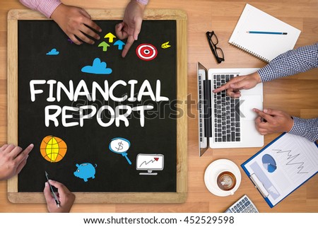 Financial Report   ( Money Cash Growth Analysis ) Businessman working at office desk and using computer and objects on the right, coffee,  top view,
