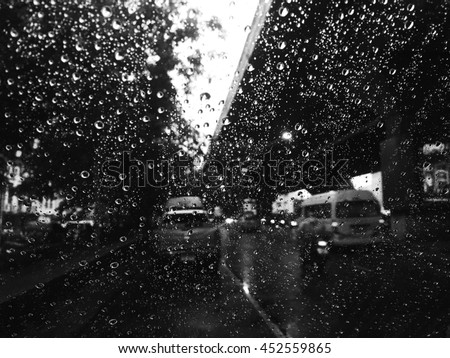 Drops of rain on glass with filter effect black & white.