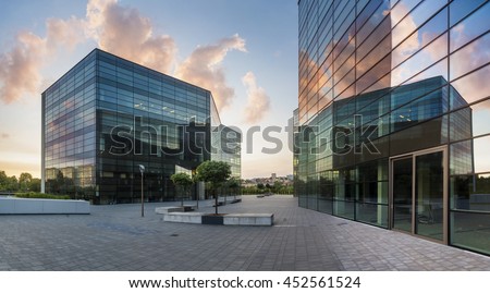 Modern office building in the evening Royalty-Free Stock Photo #452561524