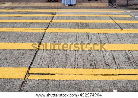 Road with yellow line for a pedestrian crossing