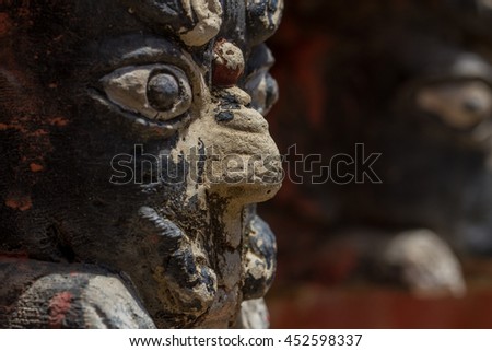 Masks on the walls of an ancient temple
