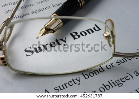 Page of newspaper with words surety bond.  Royalty-Free Stock Photo #452631787