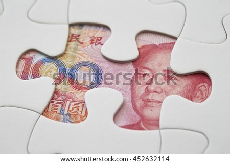 Chinese RMB bill in jigsaw puzzle