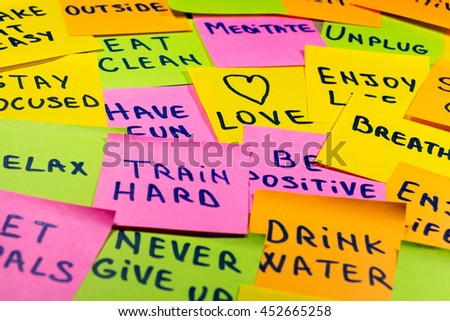 slow down, relax, take it easy, keep calm, love, meditate, go outside, enjoy life, be positive, have fun, unplug, breathe and other motivational lifestyle reminders on colorful sticky notes