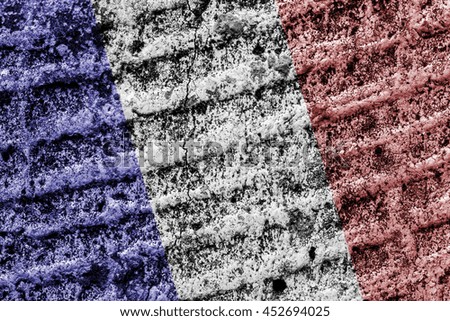 Flag of France on old grungy texture,concrete wall.