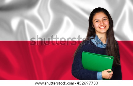 Teen student smiling over Polish flag. Concept of lessons and learning of foreign languages. Royalty-Free Stock Photo #452697730