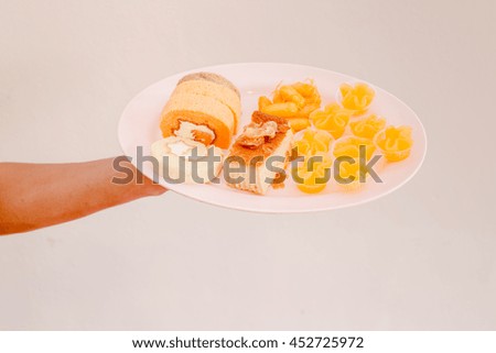 cake roll with snack on dish