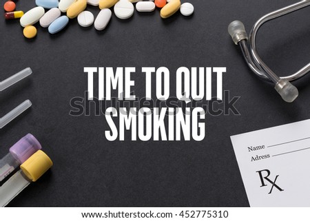 TIME TO QUIT SMOKING written on black background with medication
