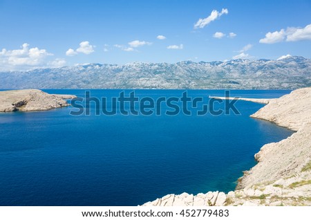 Island Pag Croatia Europe. Beautiful nature and landscape photo of Adriatic Sea in Dalmatia. Lovely sunny and warm summer day. Blue sky and nice ocean. Joyful and happy picture. Calm and relaxing.
