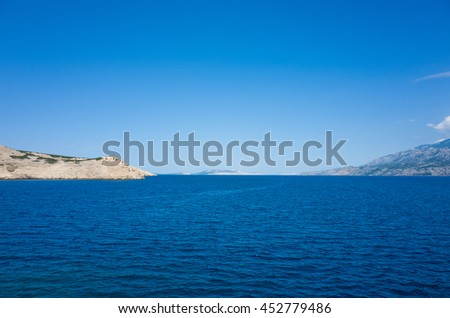 Island Pag Croatia Europe. Beautiful nature and landscape photo of Adriatic Sea in Dalmatia. Lovely warm summer day. Blue clear sky and nice colorful ocean. Joyful and happy picture. Calm and relaxing