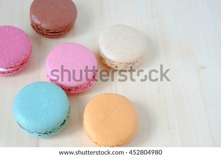 Macaroon in plate on wood table