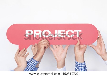 Group of people holding the PROJECT written speech bubble