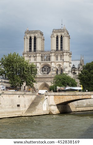 Notre Dame de Paris. France. Ancient catholic cathedral on the quay of a river Seine. Famous touristic architecture landmark in summer