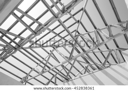 Black and white photo,Structure of steel roof frame for construction.