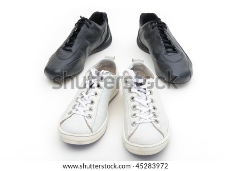 Feminine and male gym shoes. Conceptual photo expressing relations between two people.