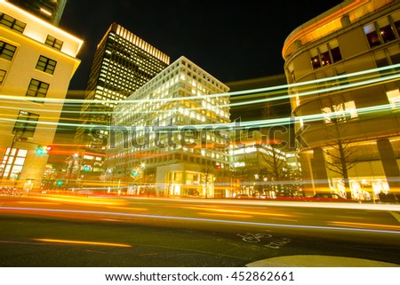 Motion blur Traffic light car drive across junction at Tokyo, Night view, Transportation in the big city.
