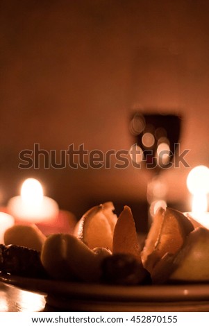 Romantic atmosphere with candles and wine.