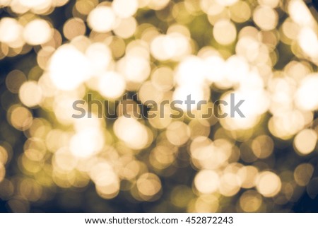 Green nature bokeh glitter defocused lights abstract background.Vintage or retro tone.