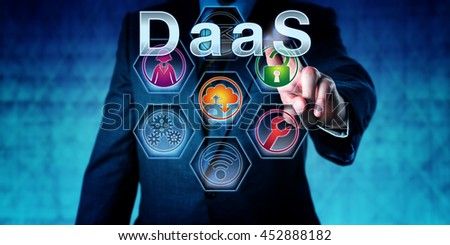 Male software developer is pushing DaaS on an interactive touch screen. Business concept. Information technology metaphor for Desktop as a Service, user virtualization and disaster recovery strategy.