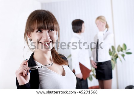 The young business woman with colleagues at office
