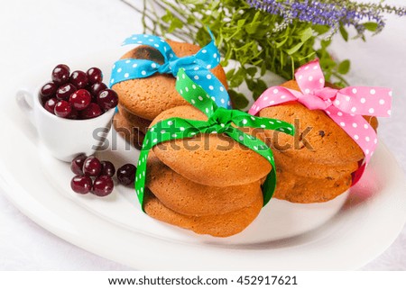 Cherry cake with berries on white background