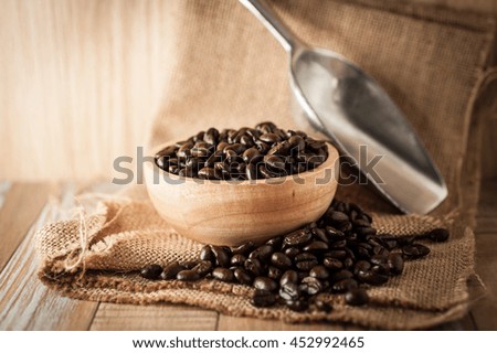 roasted coffee beans on vintage wooden background
