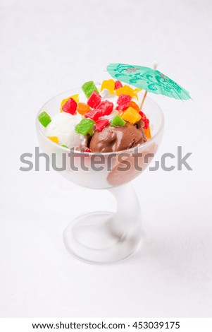 ice cream in a glass with decoration on white background