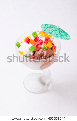 ice cream in a glass with decoration on white background
