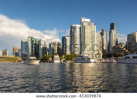 Coal Harbour viewed from the water on a cloudy evening. Picture taken in Downtown Vancouver, BC, Canada.
