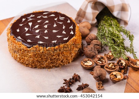nutty cake with decoration on white table