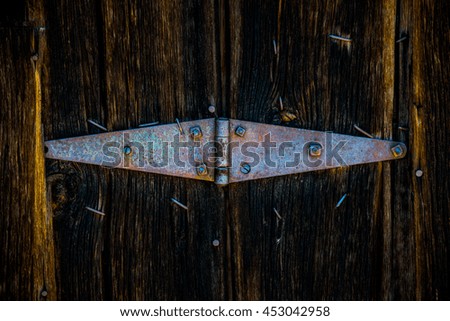 Old Rustic Hinge on Wooden Barn Doors