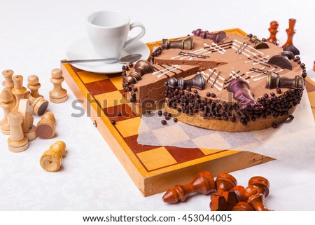 Chess cake shapes on table with figures