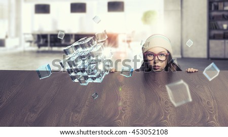 Hipster girl looking from under table . Mixed media
