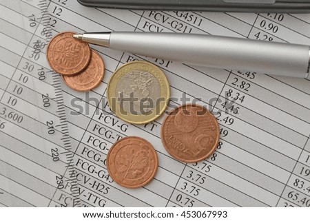 Financial background with money, ruler, calculator, table and pen.