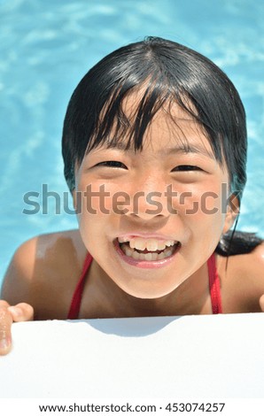 Girl playing in the pool