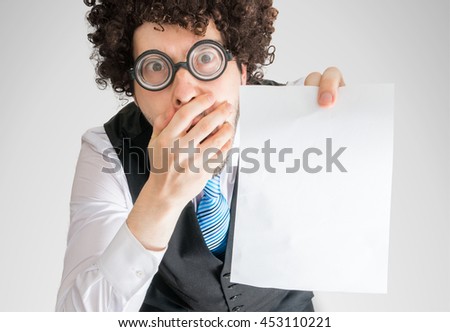 Disappointed man showing blank empty paper for custom message.