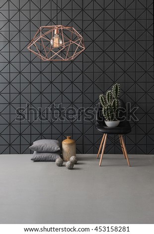 black textured wall and modern lamp black leather chair with cactus and pillow. concrete floor and ball