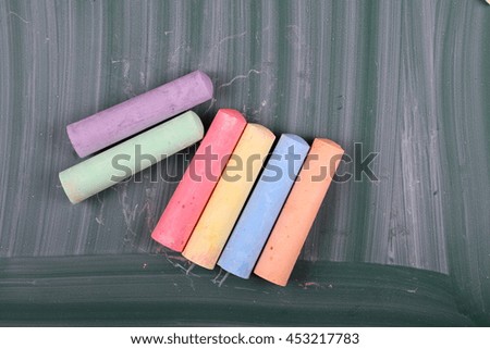 color chalks with blackboard
