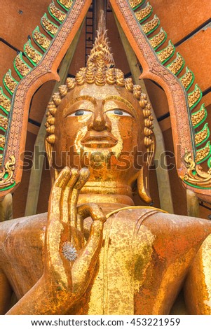 A Huge Golden Statue of Buddha at Wat Tham Sua in Kanchanaburi, Thailand