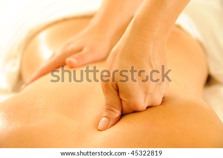 Beautiful woman in a spa with massage therapy Royalty-Free Stock Photo #45322819