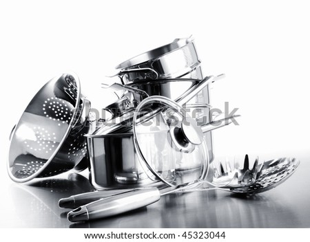 Pile of pots and pans against a white background Royalty-Free Stock Photo #45323044