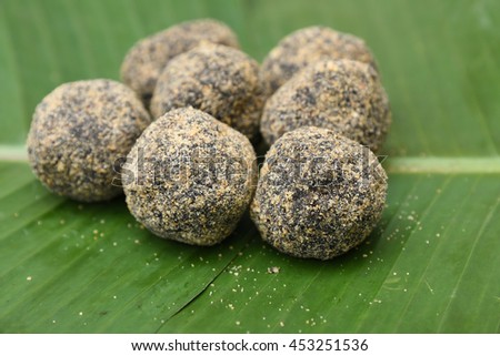 Sweet rice balls, popular traditional tea time snack of Kerala India made of flour, coconut and jaggery on Onam, Vishu, Ramadan festivals. South Indian food.
