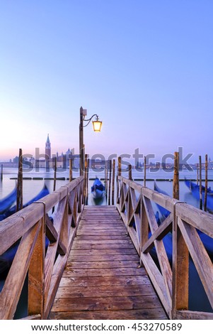 Venice. Pier for boarding the gondolas. Royalty-Free Stock Photo #453270589