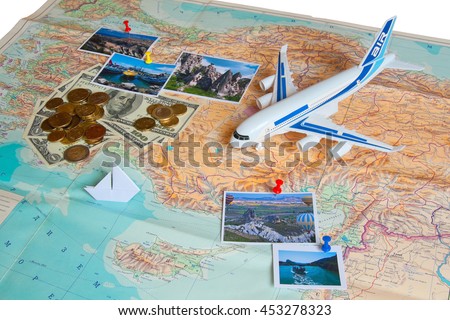 Travel concept plan and prepare for the journey to Turkey. Money, plane,ship and pictures on the map with the background of the Russian language.