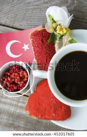 cookies with red  glaze as Turkish  flag colors. cup of coffee and a homemade flag of Turkey, decorative patriotic breakfast lunch. Selective focus photo image