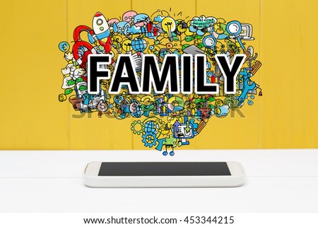 Family concept with smartphone on yellow wooden background