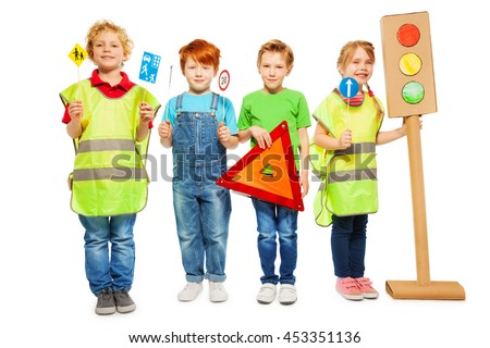 Group of four kids studying road safety rules