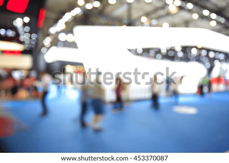 Blurry focus or defocused of lighting color effects of customer walk in market or shopping mall for use as Background