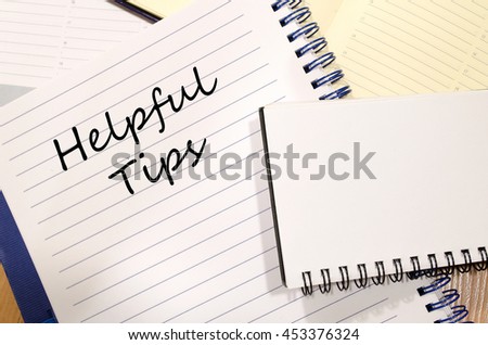 Helpful tips text concept write on notebook